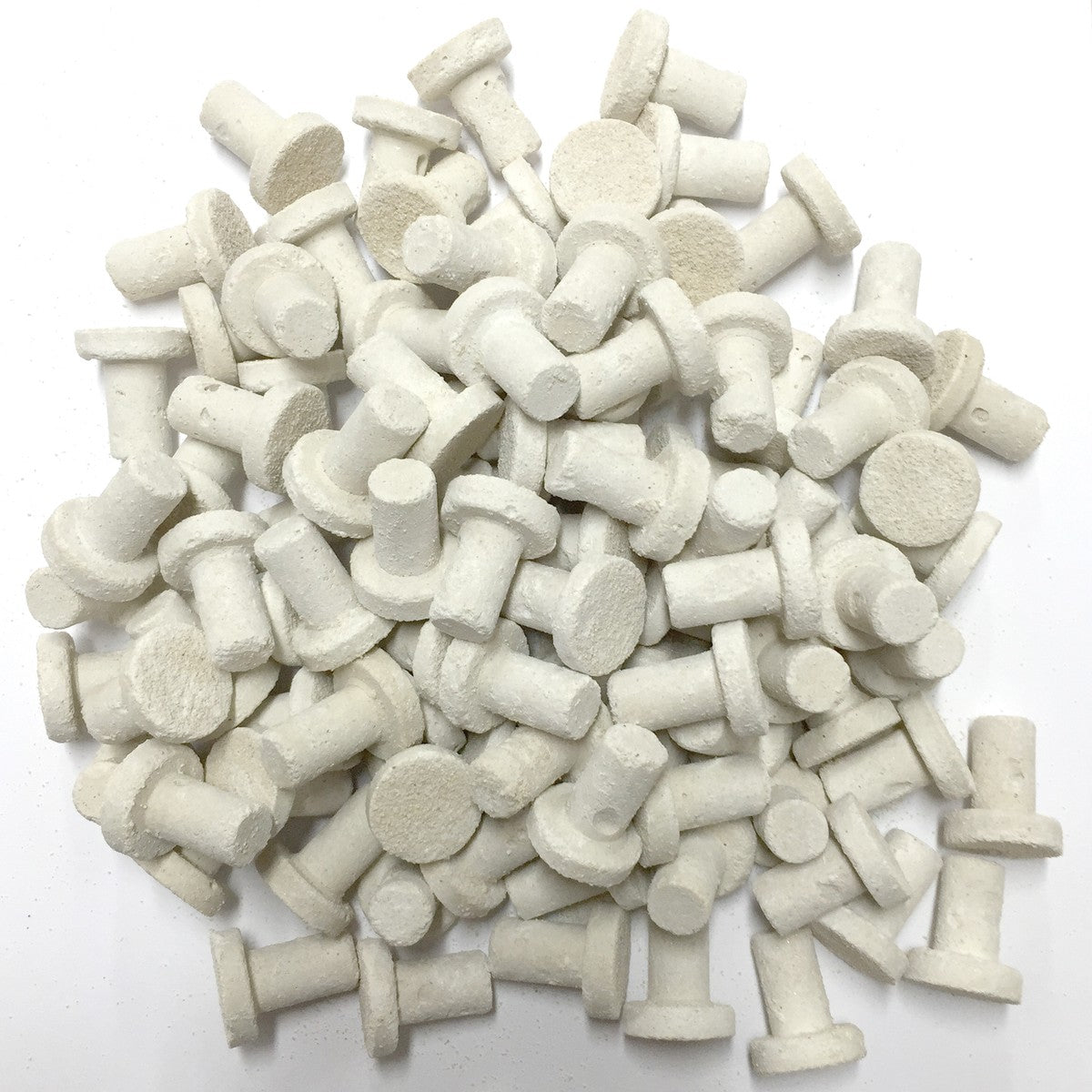 A pile of Frag Plugs used for mounting coral.