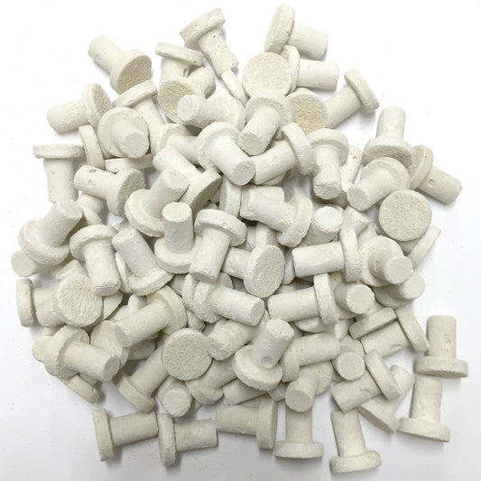 A pile of Frag Plugs used for mounting coral. 